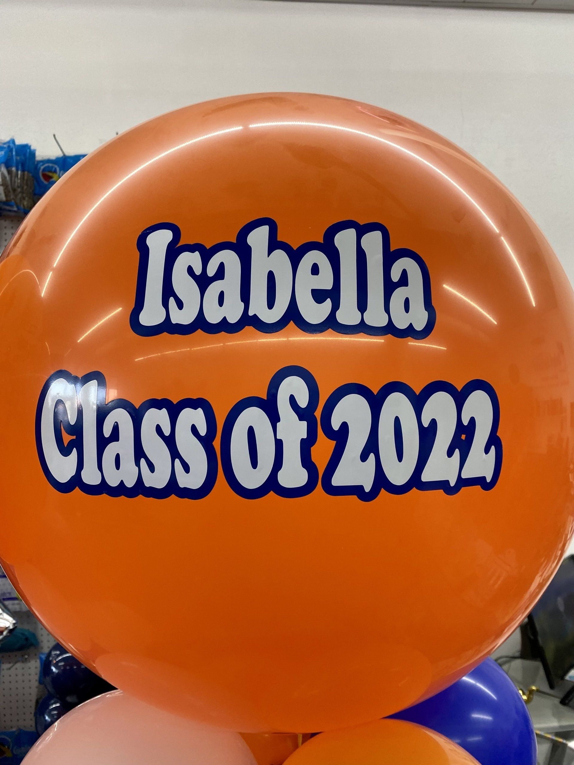 An orange balloon that says isabella class of 2022