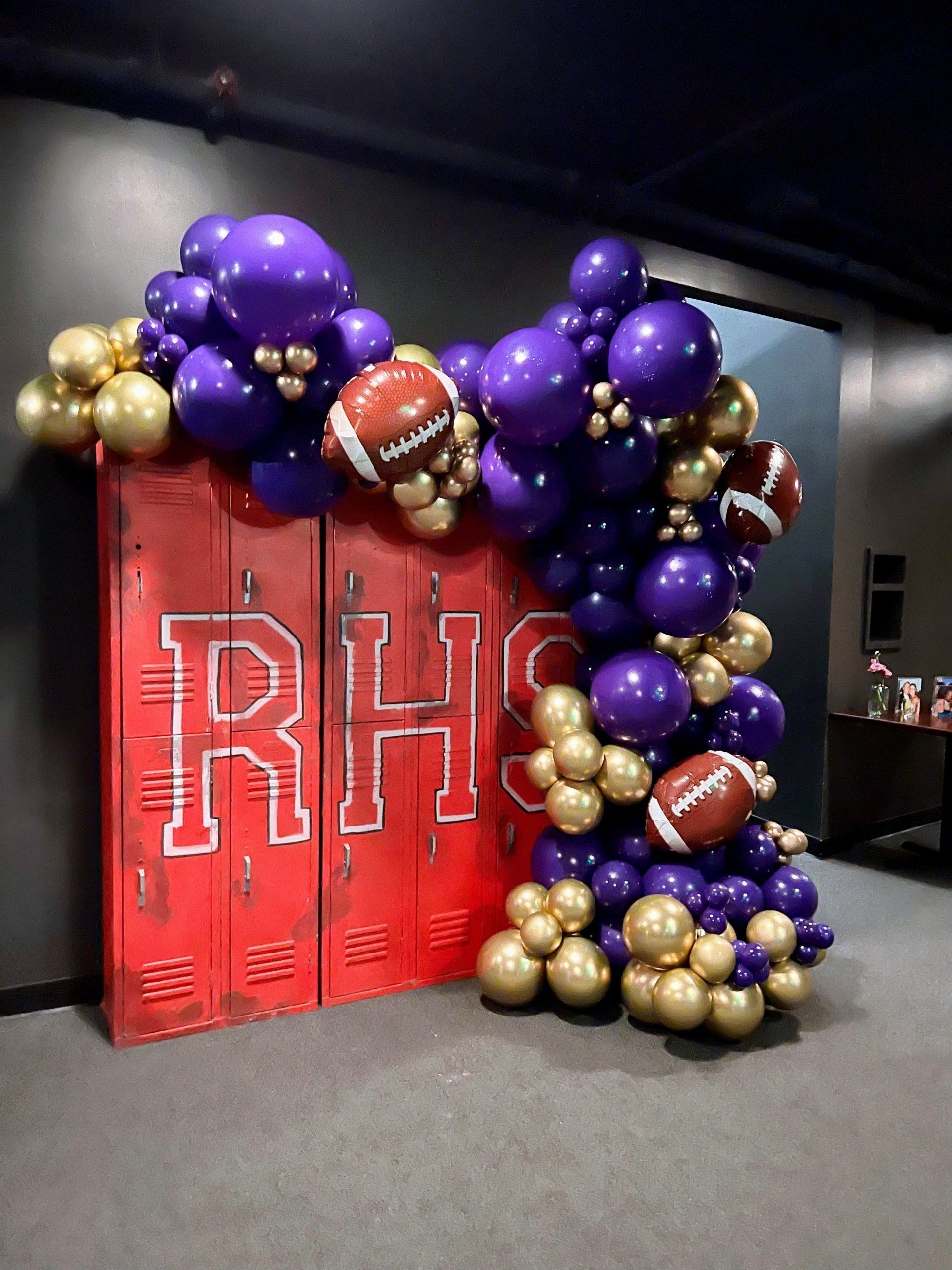 School spirit colors balloon garland with football foil balloons for sports themed celebration