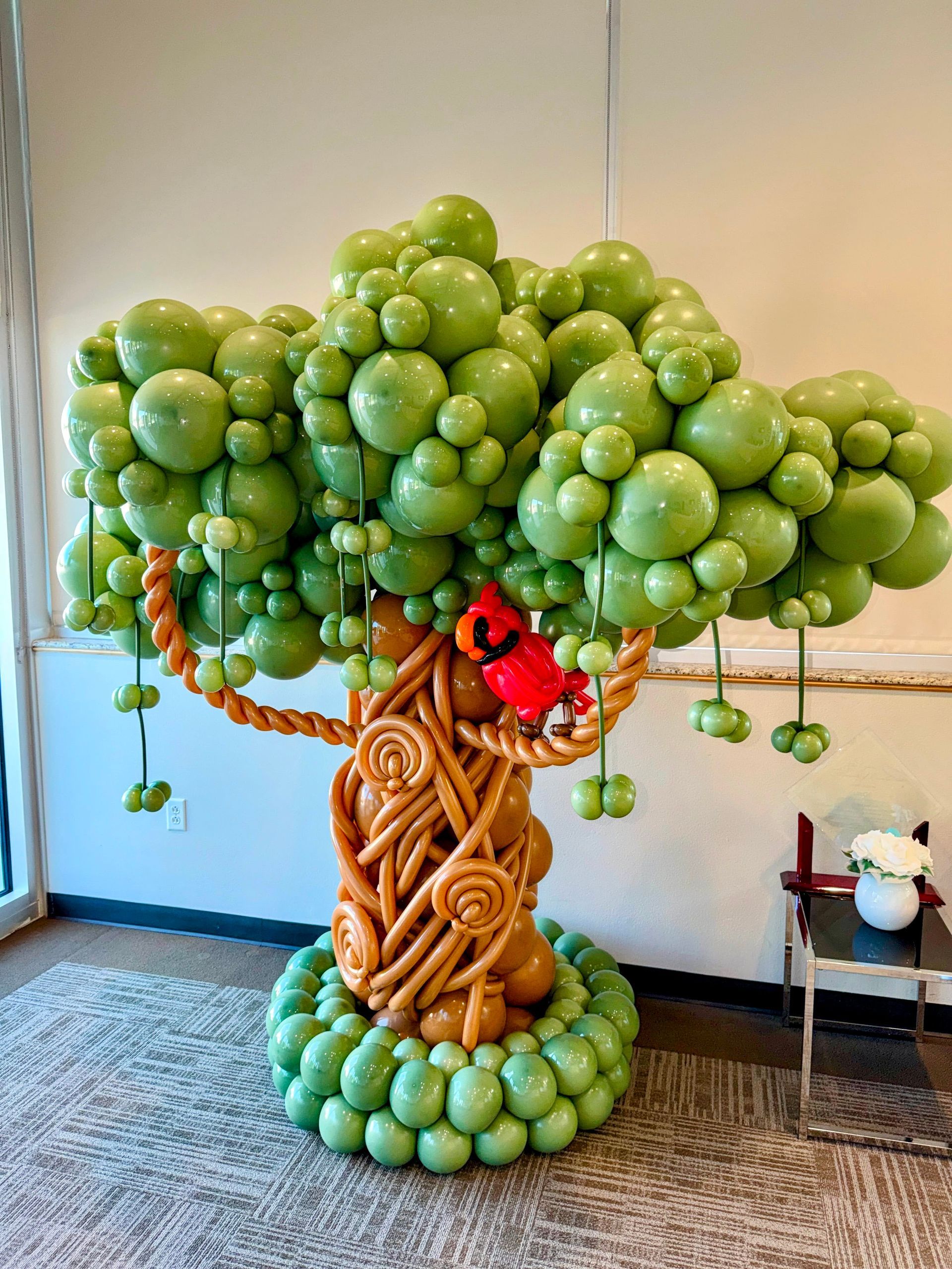 Large custom balloon tree sculpture featuring detailed twisting techniques, dimensional balloon art, and themed event decor in Fort Worth.