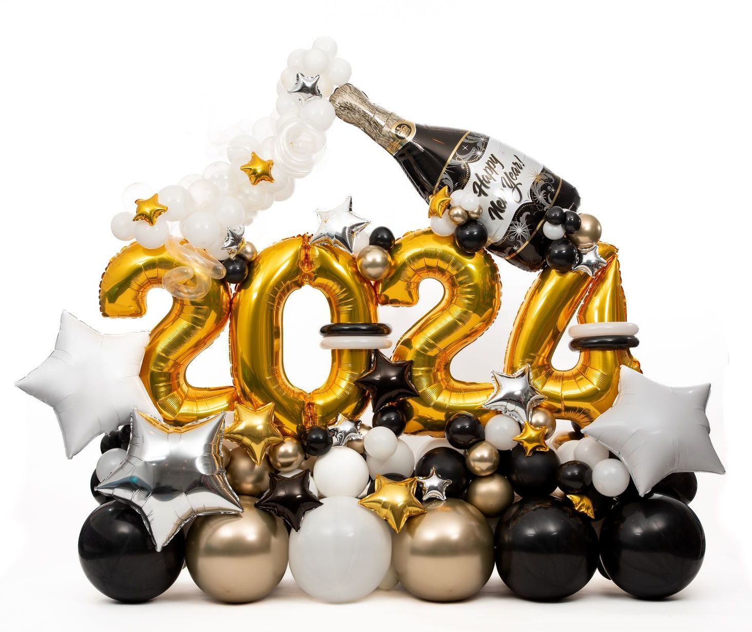 A bottle of champagne is being poured into a bunch of balloons.