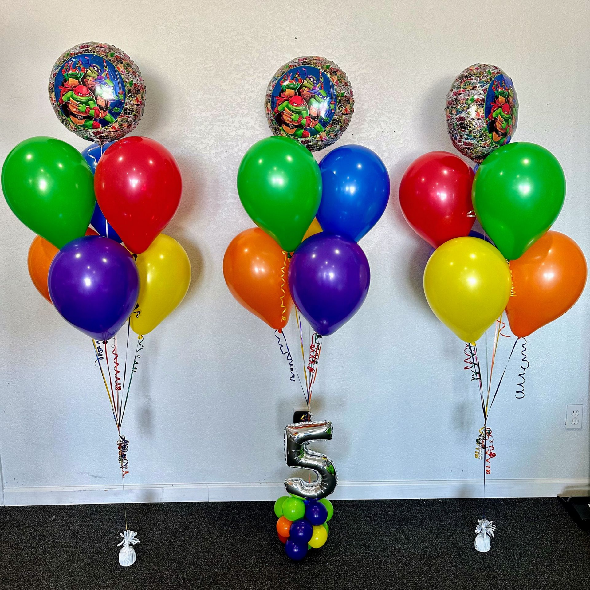 Colorful helium balloon bouquets with latex balloons for party decor and event setups in Fort Worth Texas