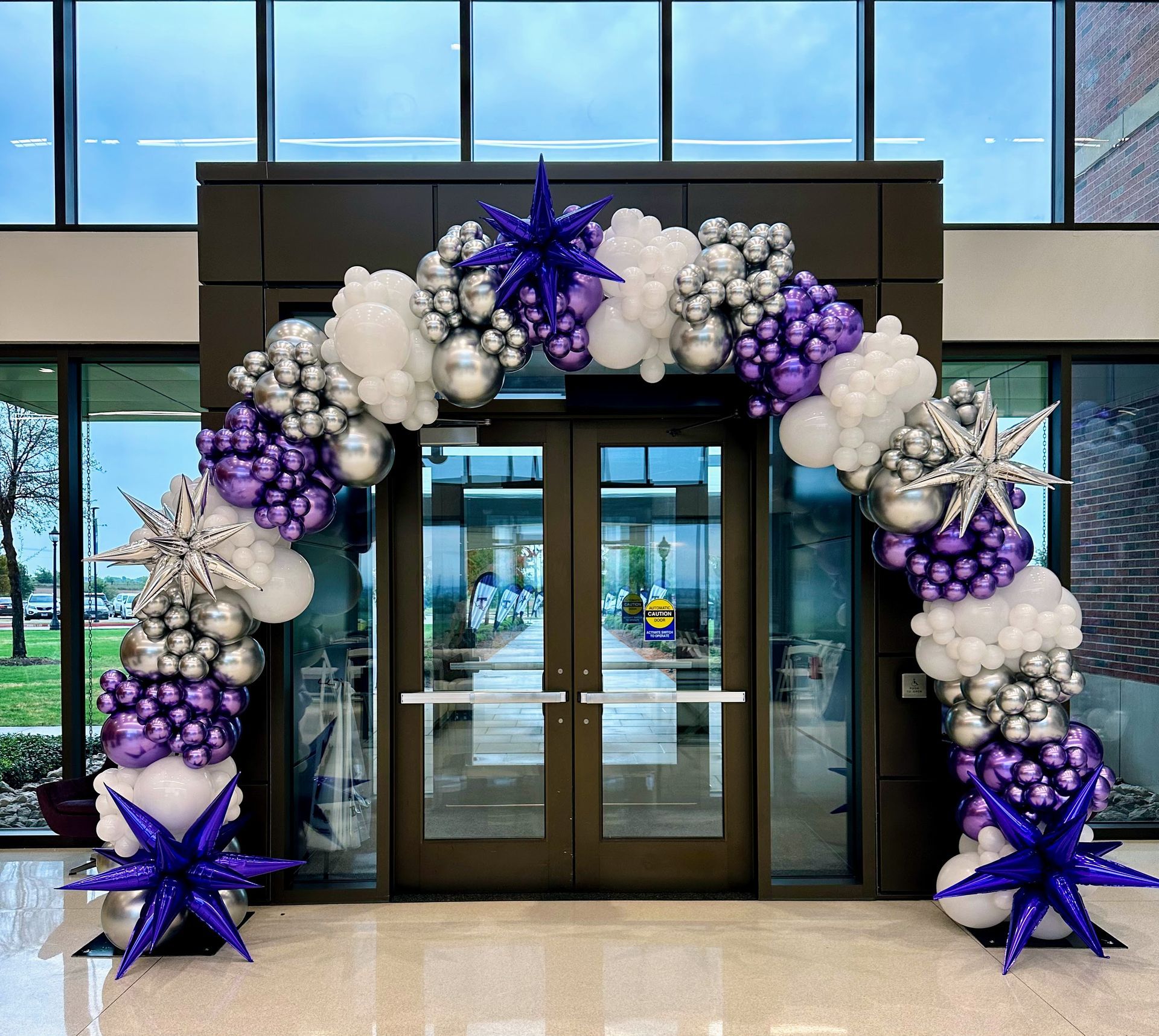 School spirit balloon installation with custom balloon designs for school celebrations, open houses, and welcome-back events