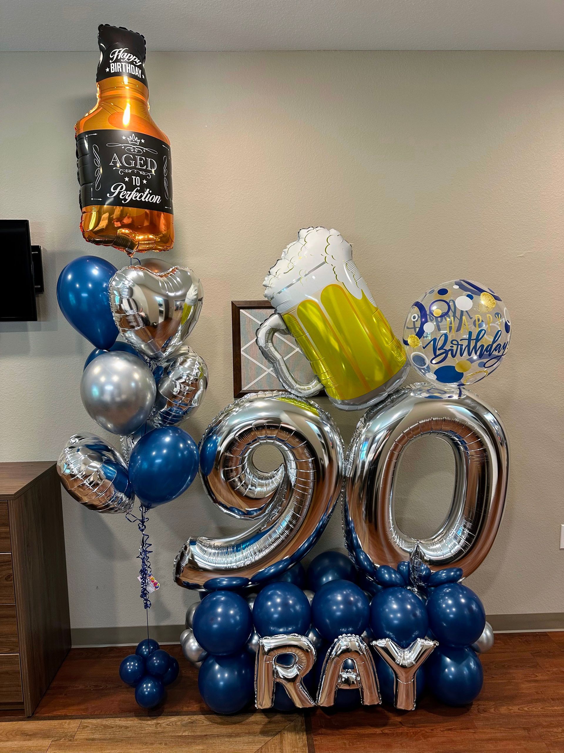 Milestone number balloon marquee with helium balloon bundle for anniversaries and celebrations