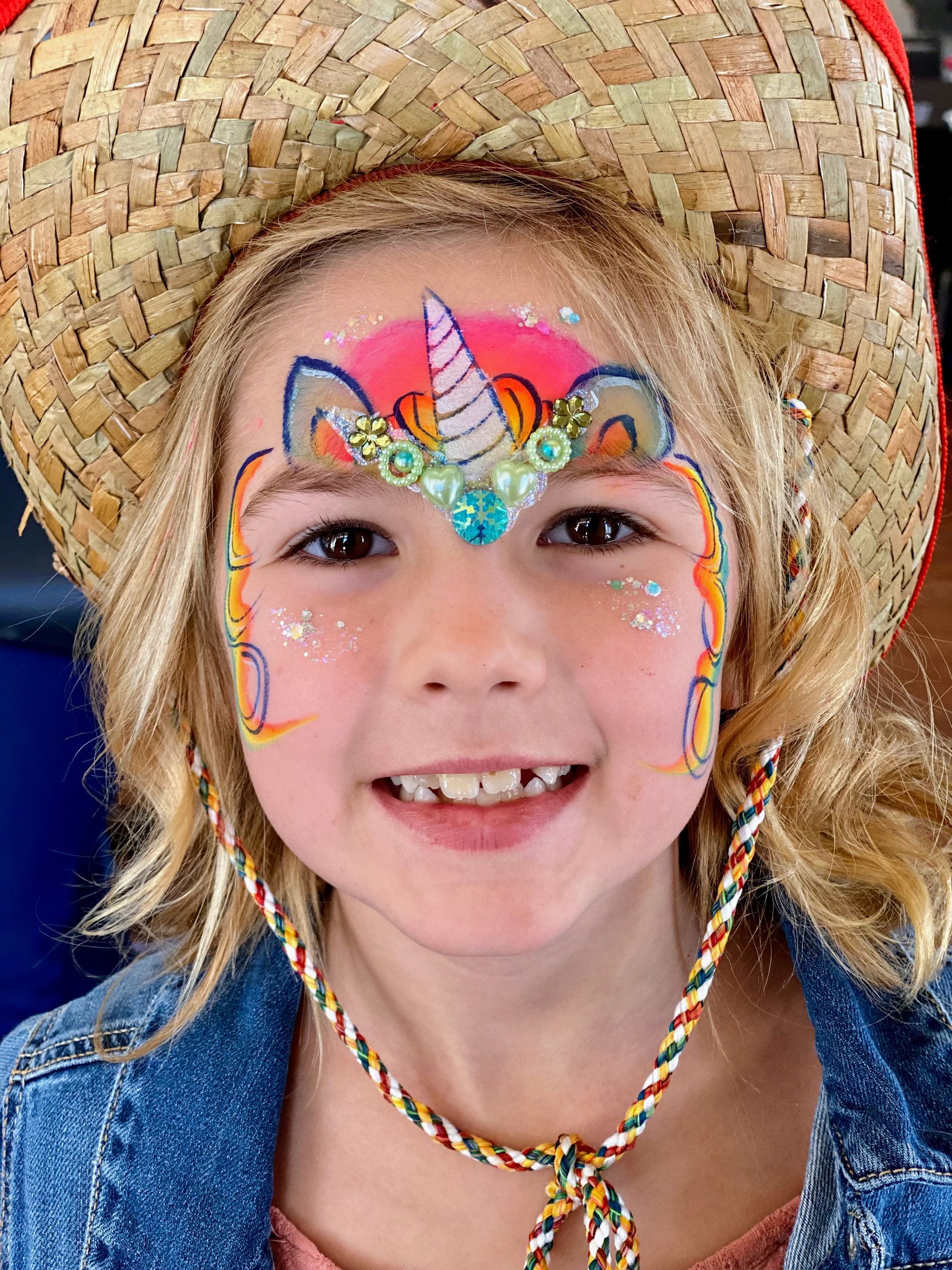 a girl with unicorn face paint