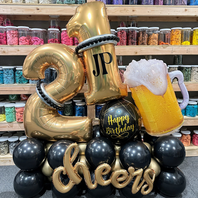 Balloon marquee bouquet with number 21 and themed balloons for birthday party setup in Fort Worth