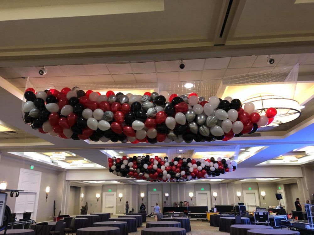 30 foot balloon drop net installed in a large event venue for a timed balloon release