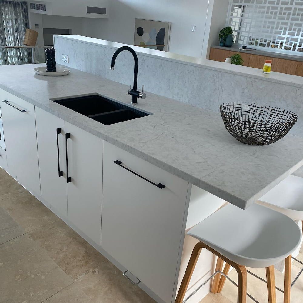 A Kitchen With White Cabinets And A Bowl On The Counter — Cross Cabinets In Caloundra, QLD