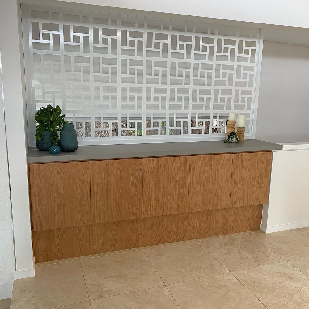 A Wooden Counter In A Room With A White Wall Behind It — Cross Cabinets In Chevallum, QLD