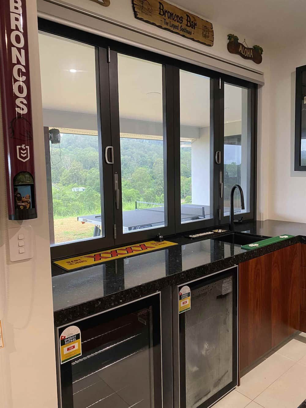 A Kitchen With A Sink, Refrigerator, And Large Windows — Cross Cabinets In Chevallum, QLD