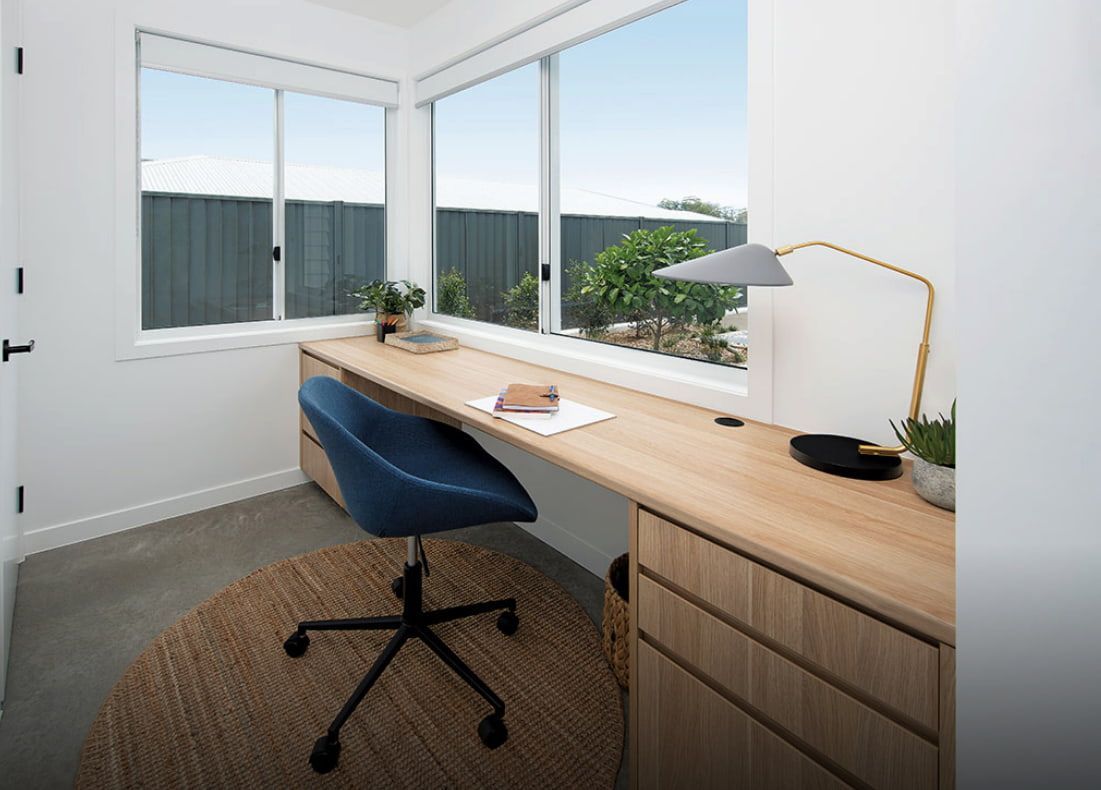 A Home Office With A Desk And Chair In Front Of A Window — Cross Cabinets In Chevallum, QLD