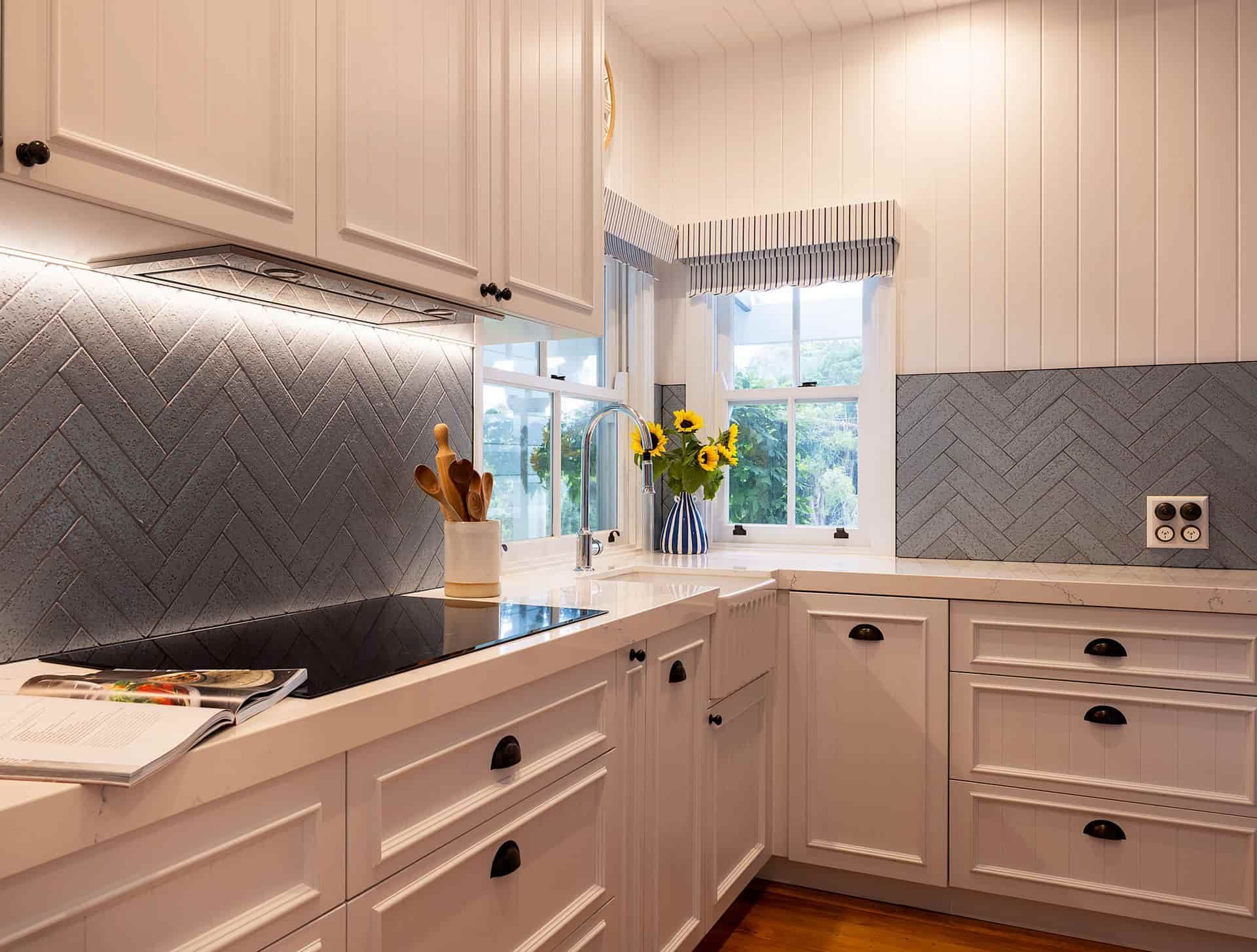A Kitchen With White Cabinets And A Stove Top Oven — Cross Cabinets In Chevallum, QLD