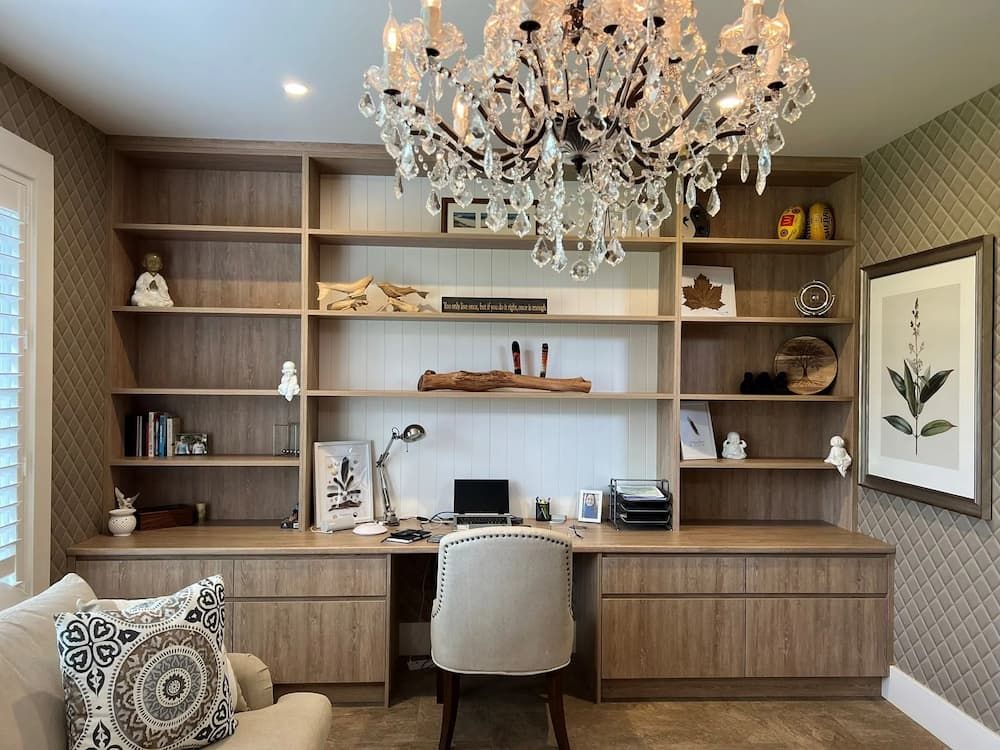 A Home Office With A Desk And Chair Under A Chandelier — Cross Cabinets In Chevallum, QLD