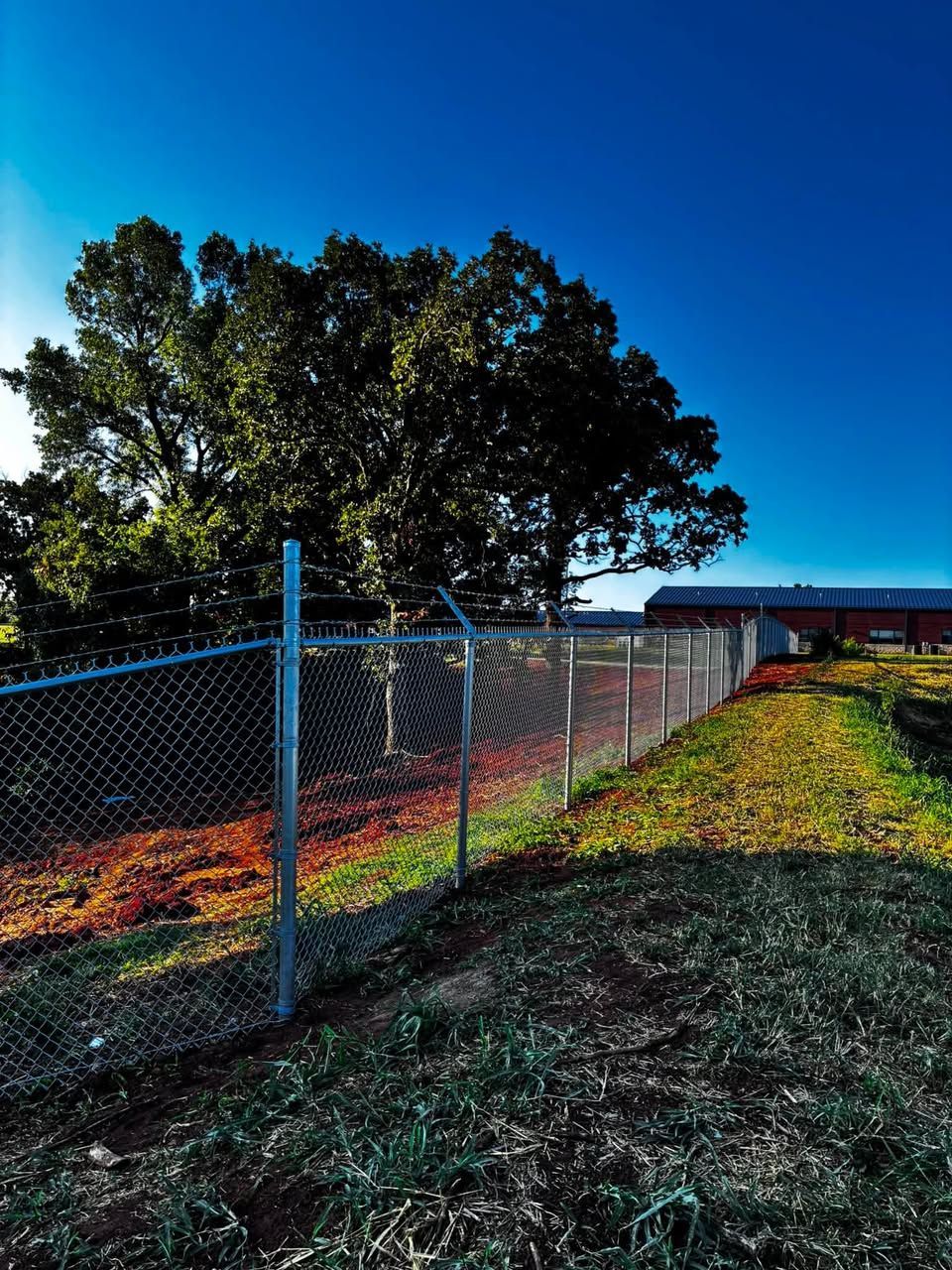 A wooden fence with a pergola on top of it