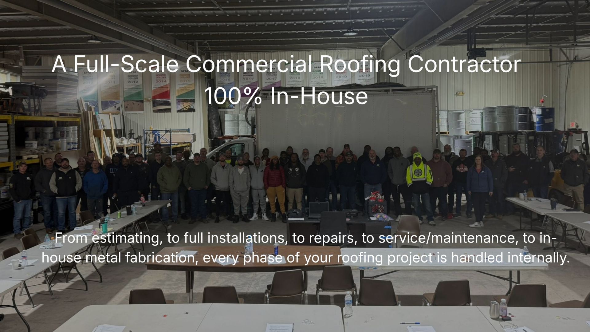 Commercial roofing contractor team standing inside a warehouse with text advertising in-house roofing services