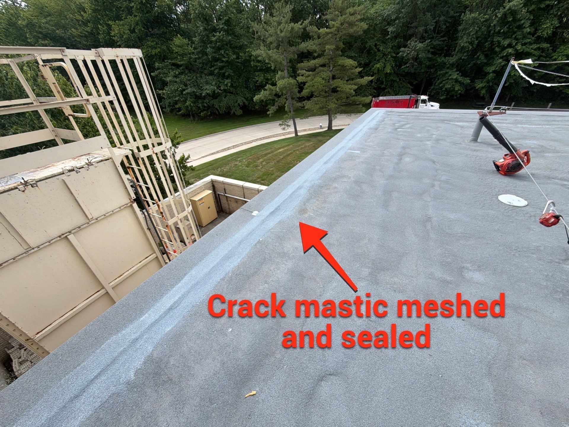 commercial roof maintenance in Westlake, Ohio. Crack mastic meshec and sealed.