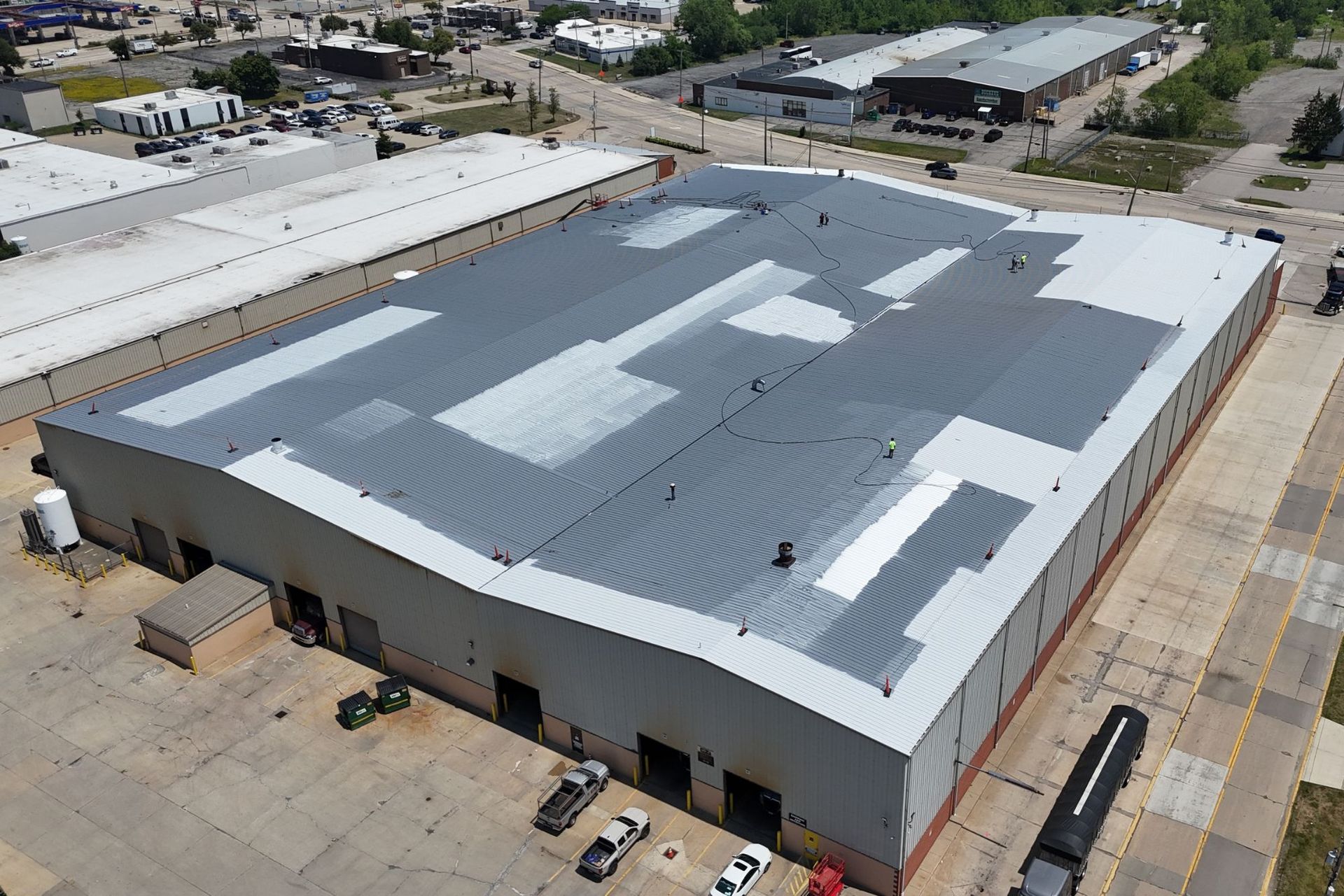 Commercial roofing project completed in Bedford, Ohio. Silicone coating over an existing metal roof.