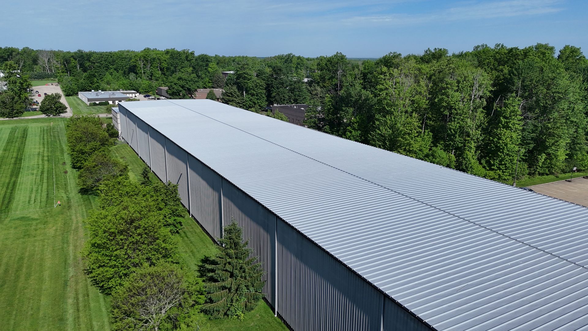 Spray-on roof coating system installed over an existing metal roof in Strongsville, Ohio in 2026.