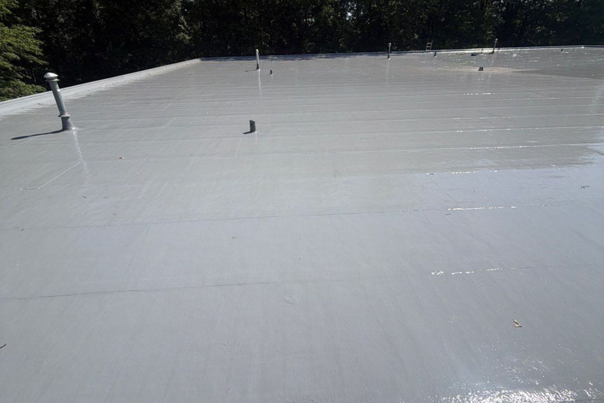 finished silicone coating installed over and existing smooth torch down roof in Euclid, Ohio