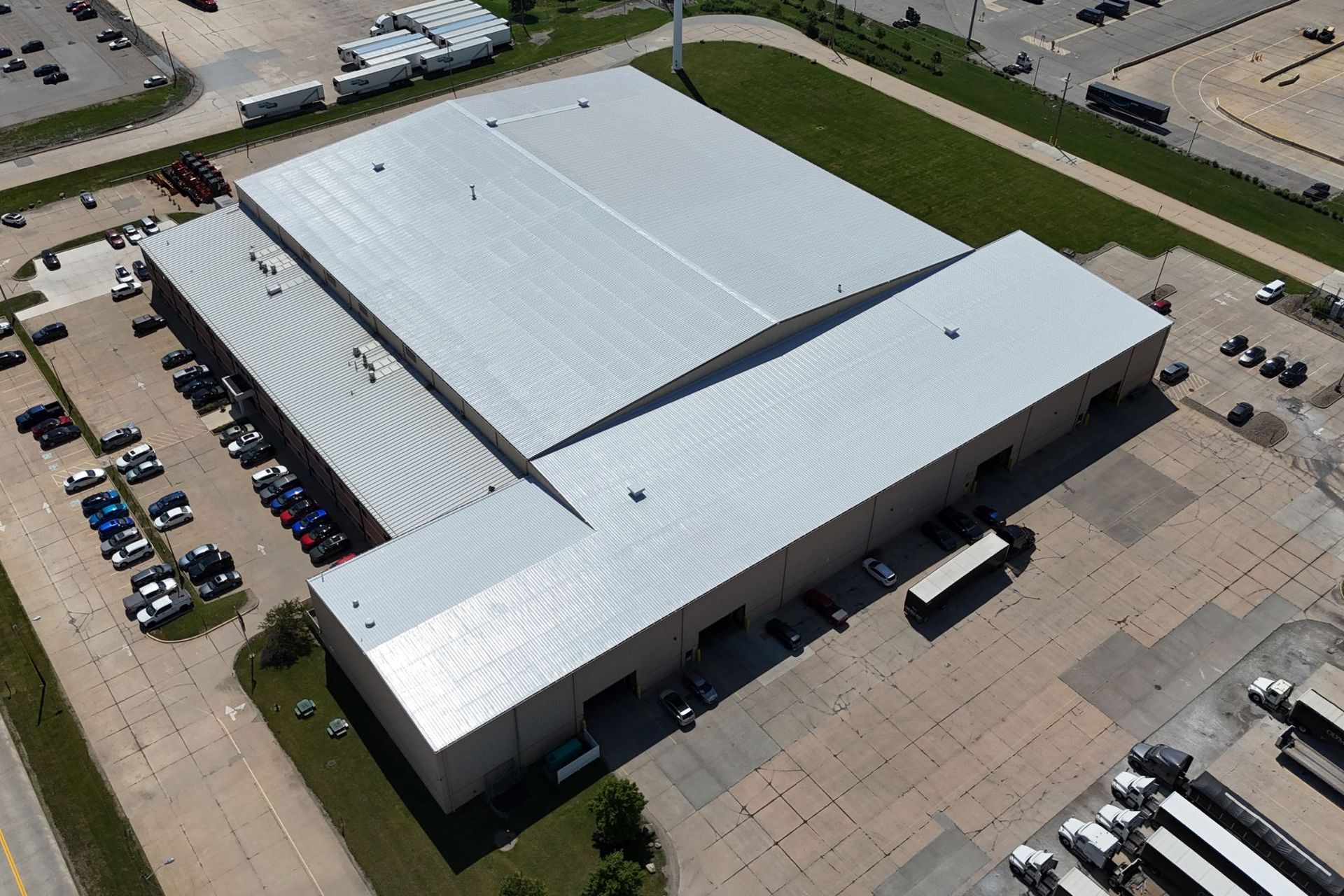 Finished silicone roof coating installation over an existing metal roof - Olympic Steel - Bedford, Ohio