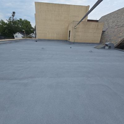 Spray foam roofing system installed over an existing spray foam roof in Akron, Ohio.