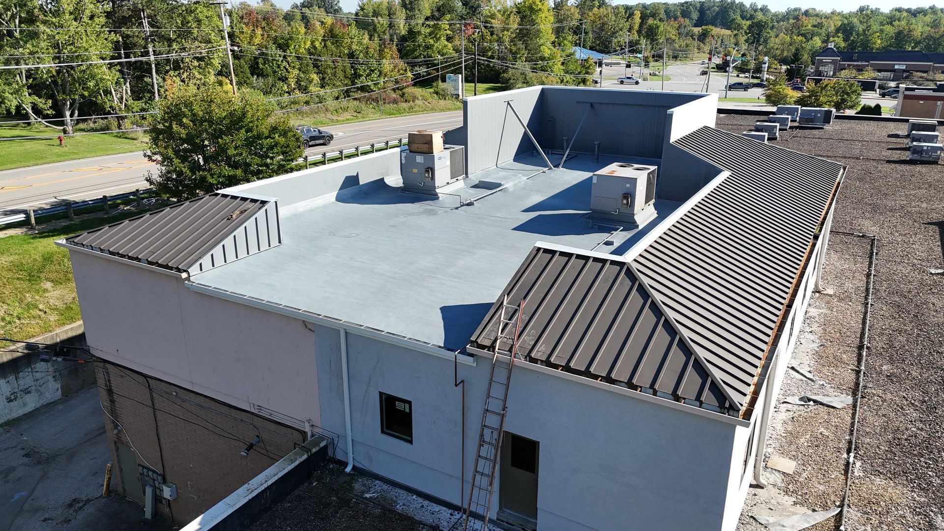 Spray foam roofing system installed over gravel built-up in Medina, Ohio in 2026.