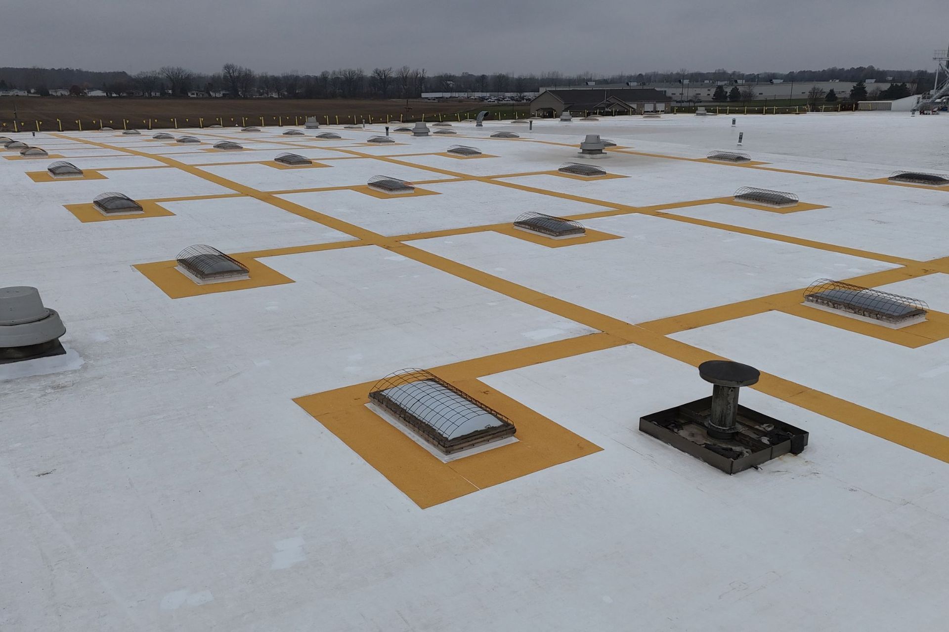 Roof coating system installed over an existing PVC roof in Michigan