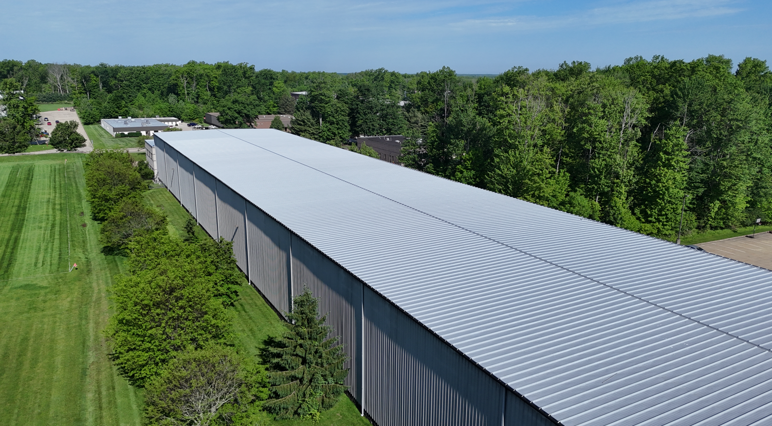 roof coating system installed on a commercial metal roof in 2026.
