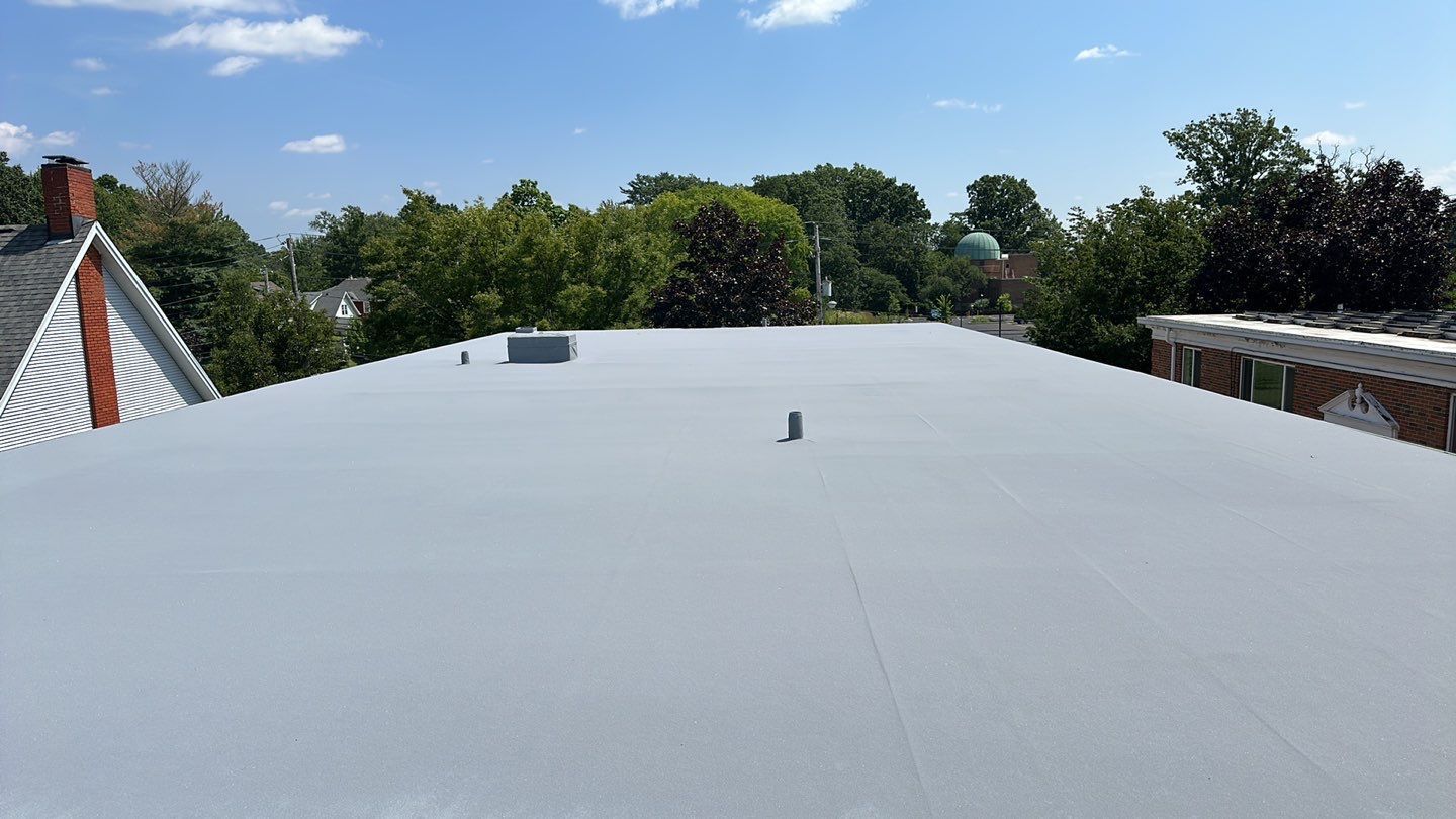 Spray-on roof coating system over an existing TPO roof in Berea, Ohio