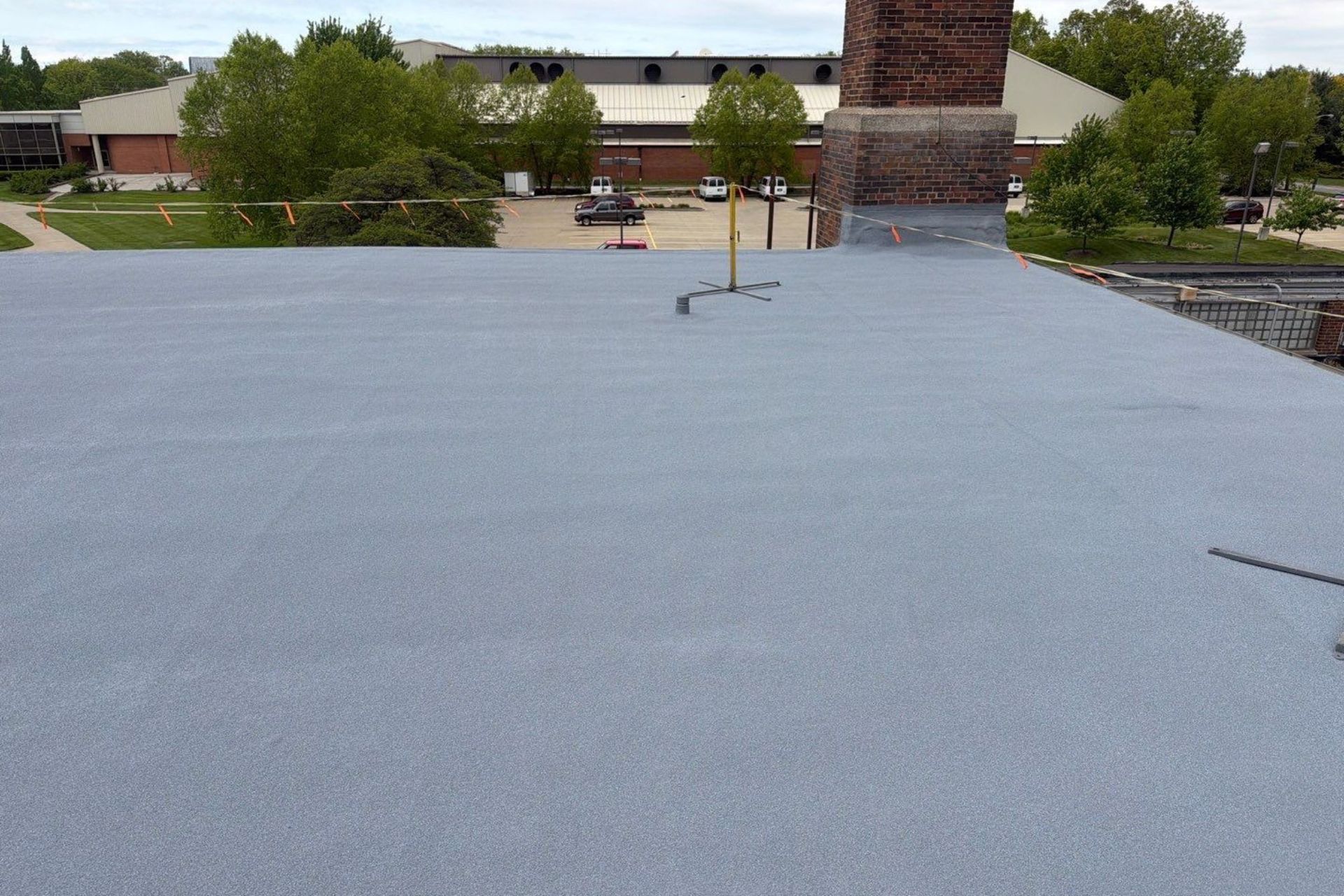 torch down roof at baldwin wallace university that's been restored by installing the spray foam roofing system over top