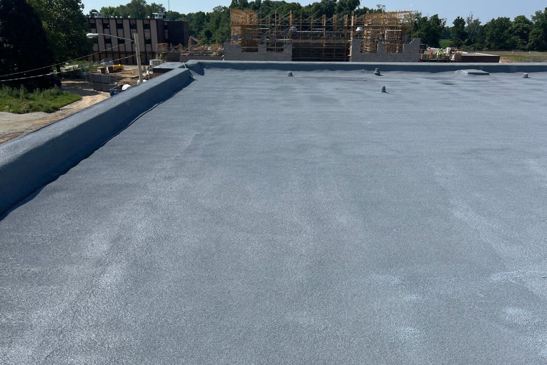 Torch down roof in Yellow Springs, Ohio that was repaired by installed the spray foam roofing system over top