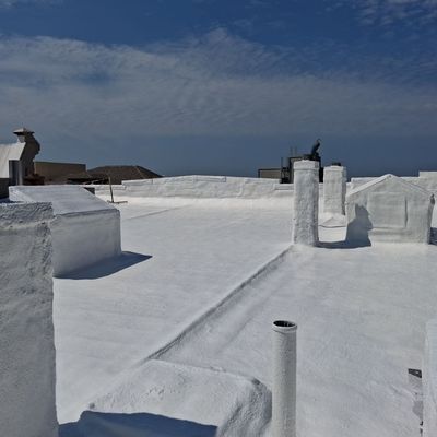 Silicone coating over an existing spray foam roof at Aldridge Restoration's roof in Sandusky, Ohio.