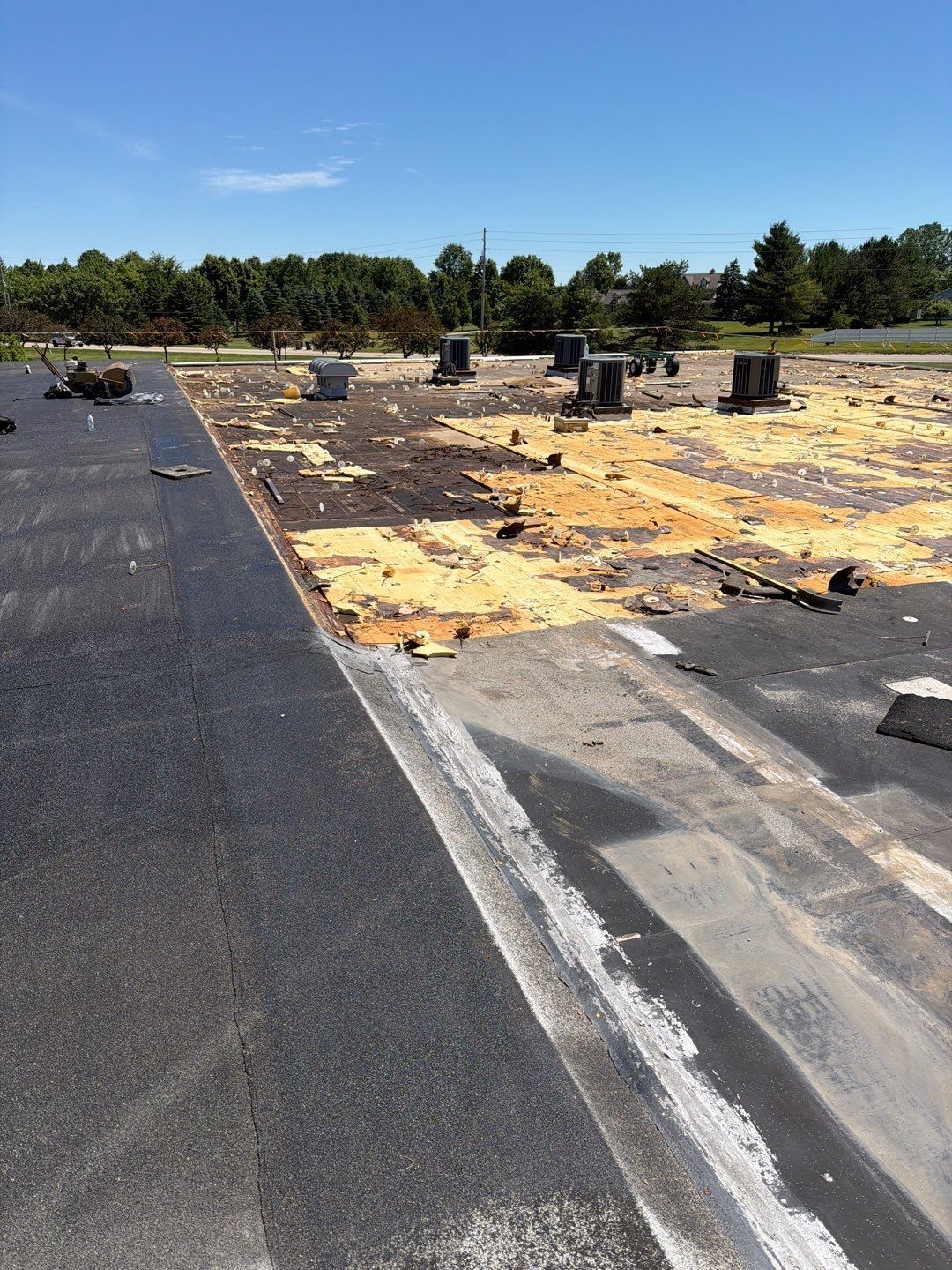 Wet insulation on a commercial school roof that needed to be ripped off and replaced