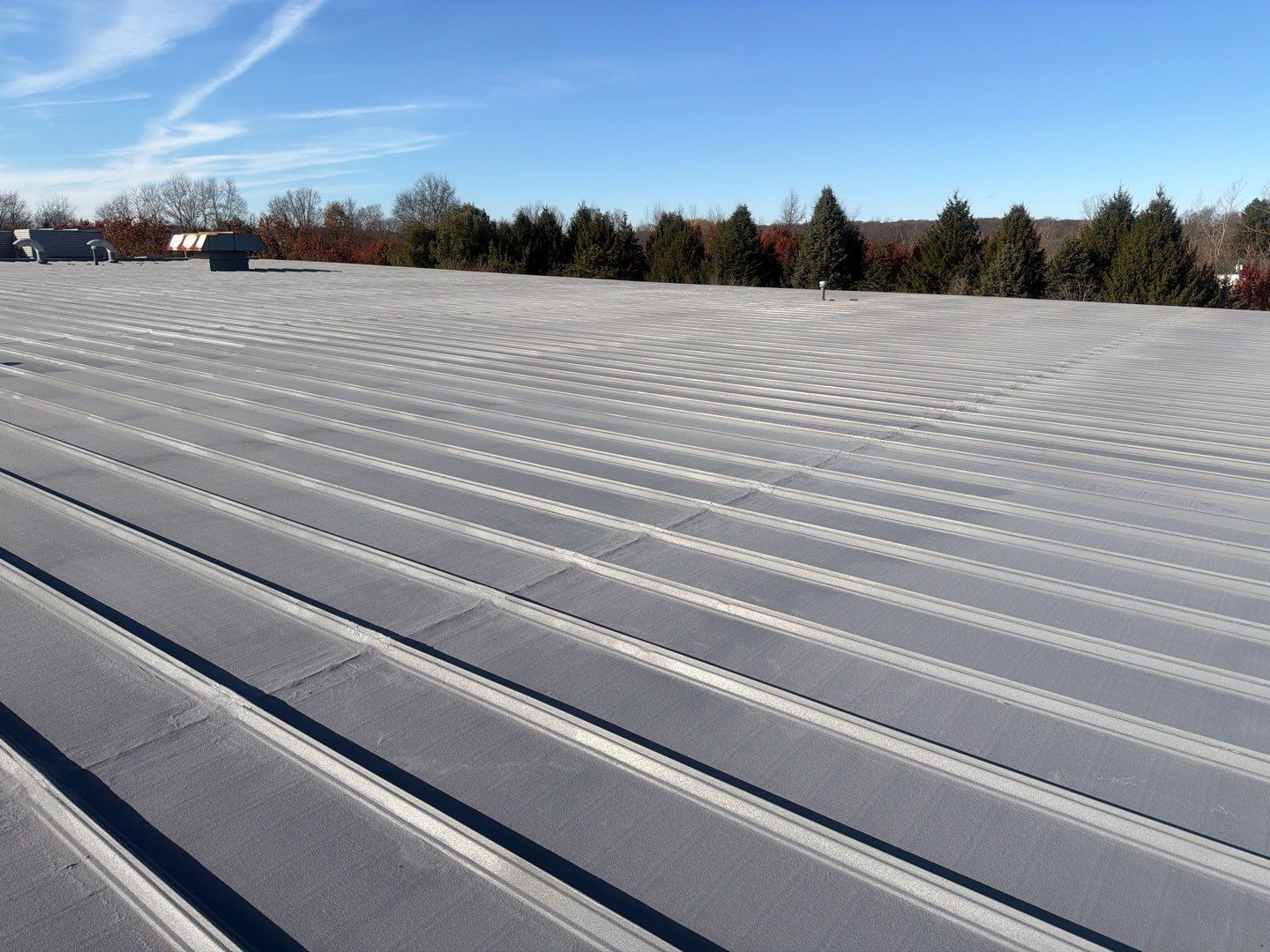 Metal roof in Wadsworth, Ohio, that's been repaired by installing a roof coating system.