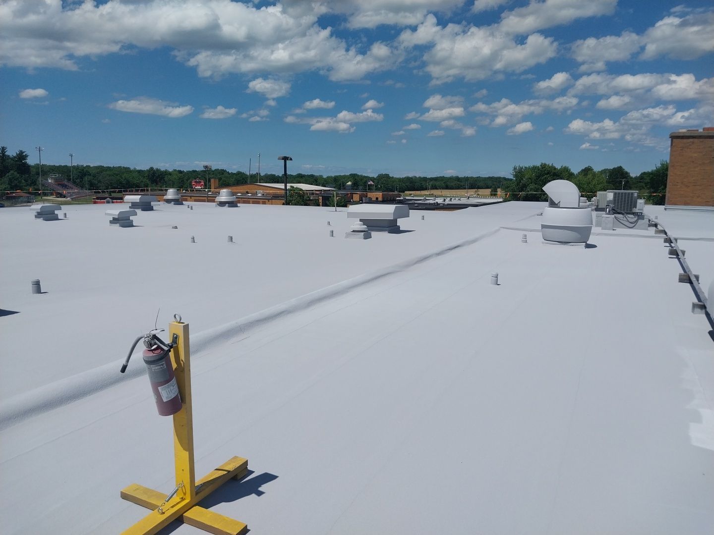 finished roof coating system installed on school roof in Medina, Ohio