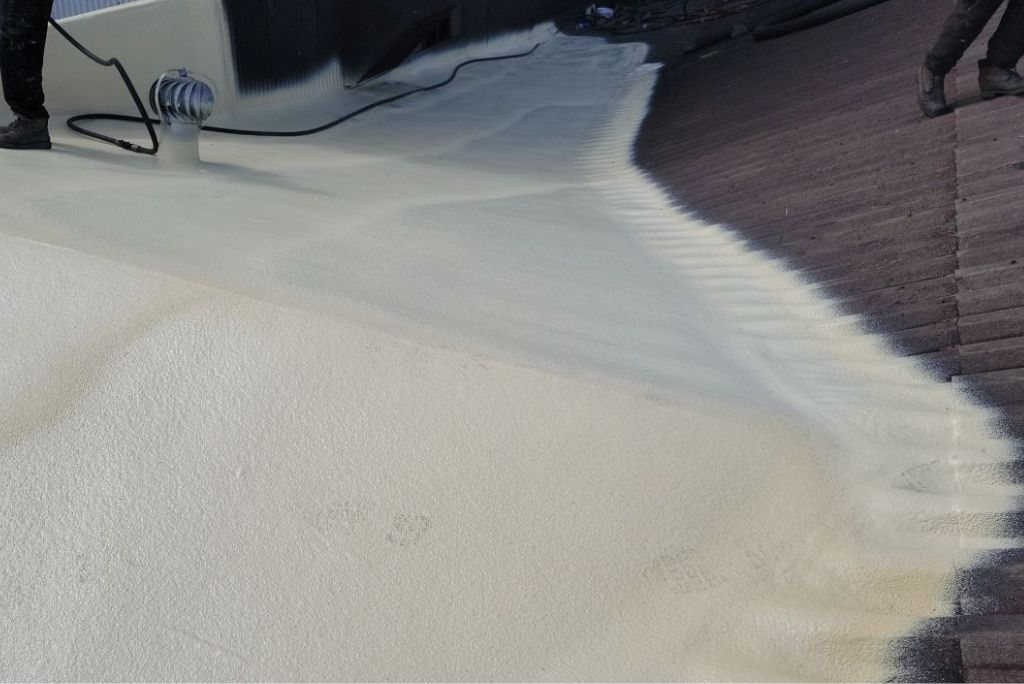 spray foam over plywood on a commercial roof in Elyria, Ohio