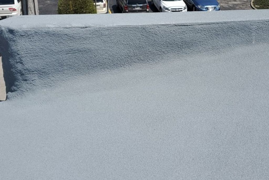 Completed commercial roofing section of a spray foam roof install in Berea, Ohio
