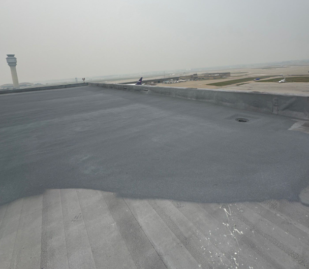 Smooth modified torch down roof in Cleveland, Ohio that’s been restored by installing the spray foam