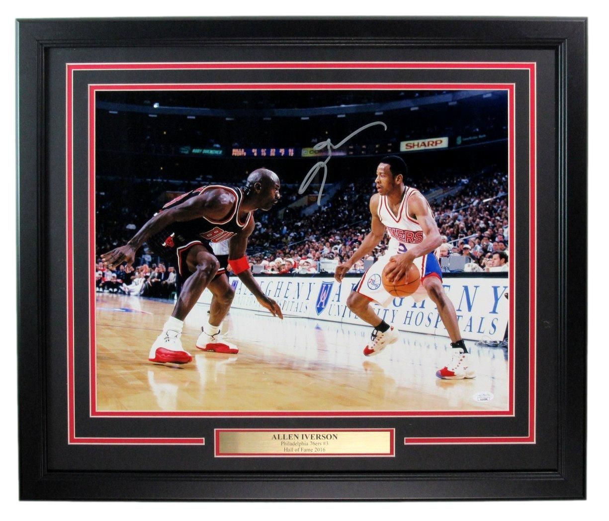 Michael Jordan guarding Joe Dumars in a basketball game, signed framed photo.