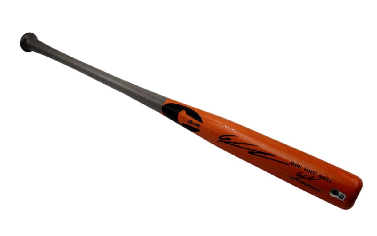 Baseball bat with orange wood and gray handle, signed with black ink.