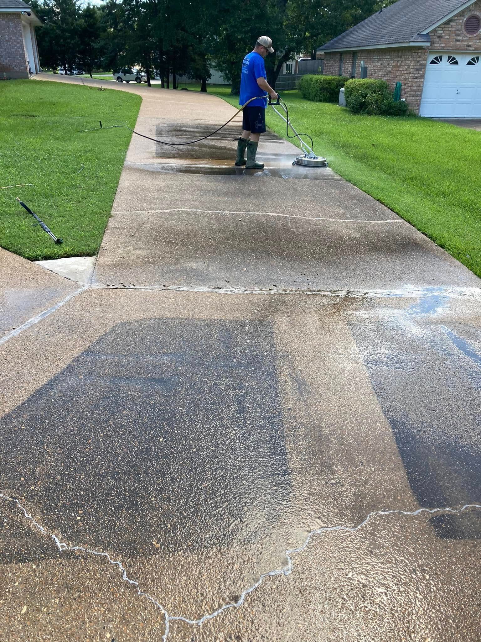 a man watering the surface