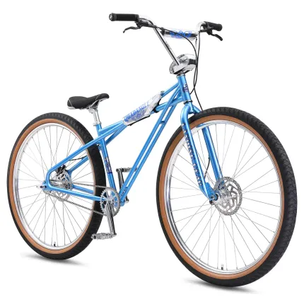 Blue bicycle with tan tires on a white background Blue bicycle with tan tires on a white background