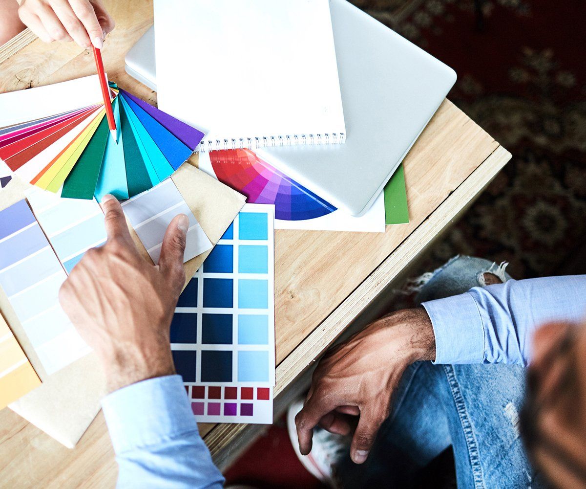 Client Choosing Color For Interior Painting — Longmont, CO — Francia's Painting LLC Client Choosing Color For Interior Painting — Longmont, CO — Francia's Painting LLC