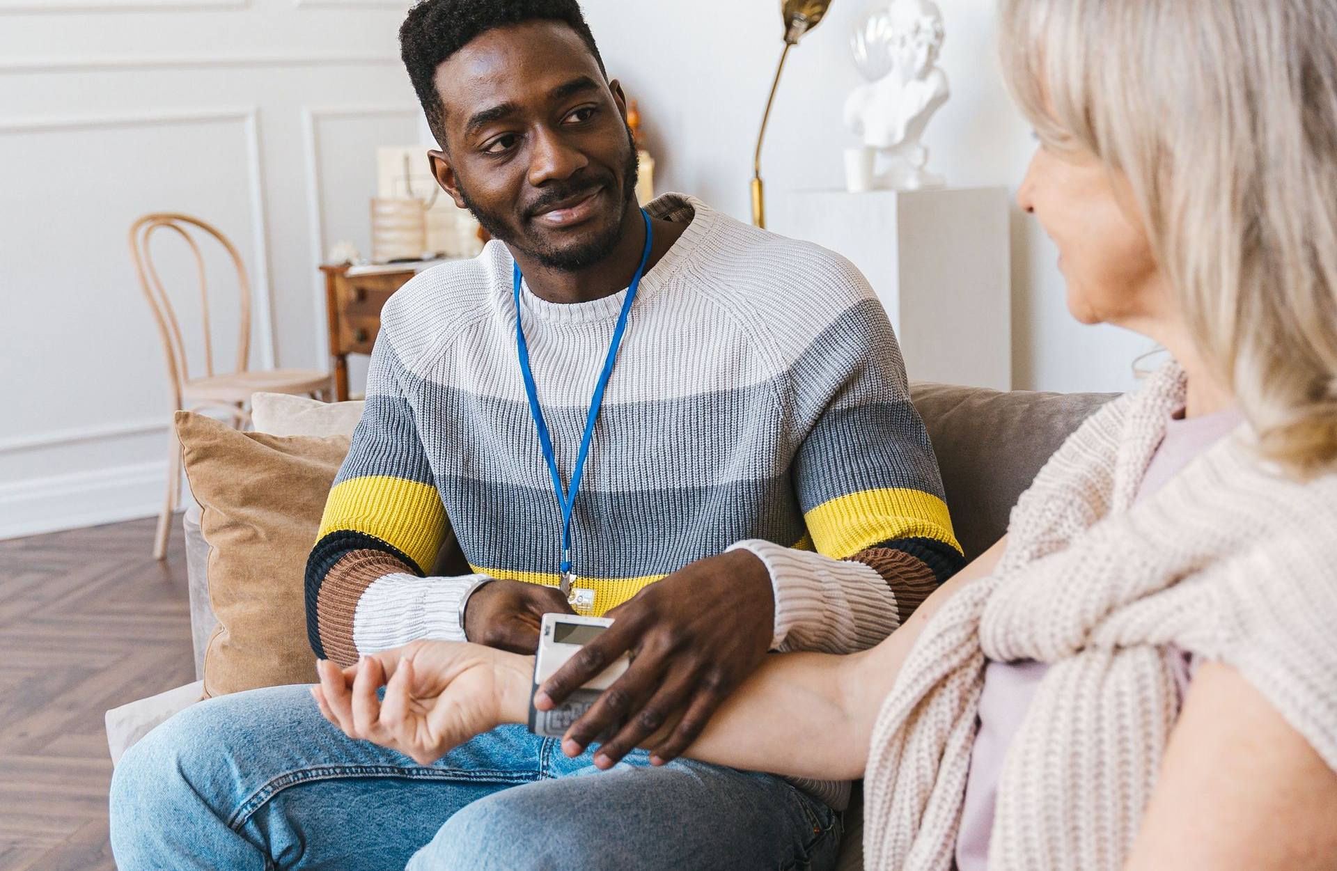 Home Caregiver Taking Blood Pressure in Darien, CT