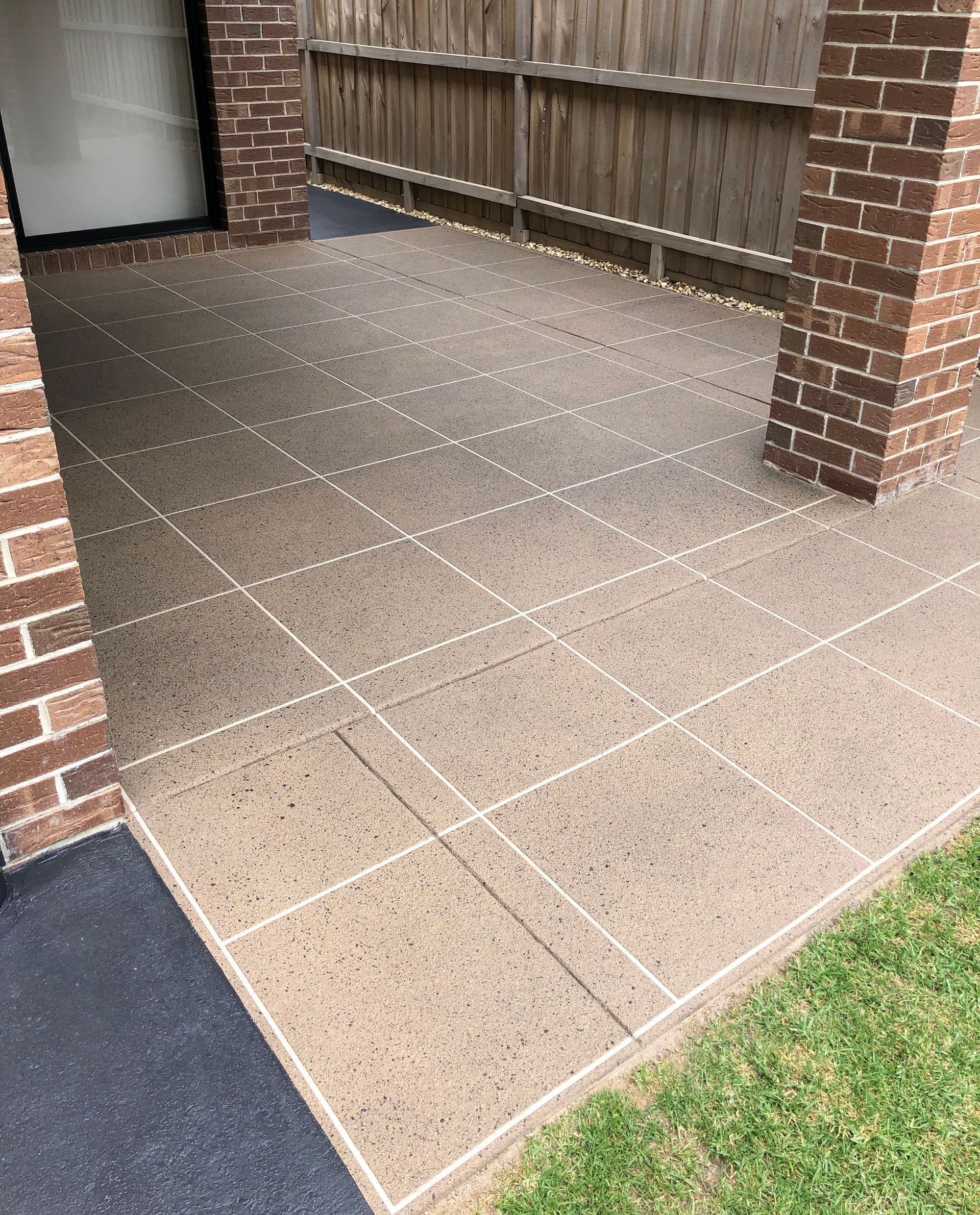 Custom hand-laid stencil concrete resurfacing and clear sealing in Clyde North by Melbourne Concrete Sealing and Resurfacing.