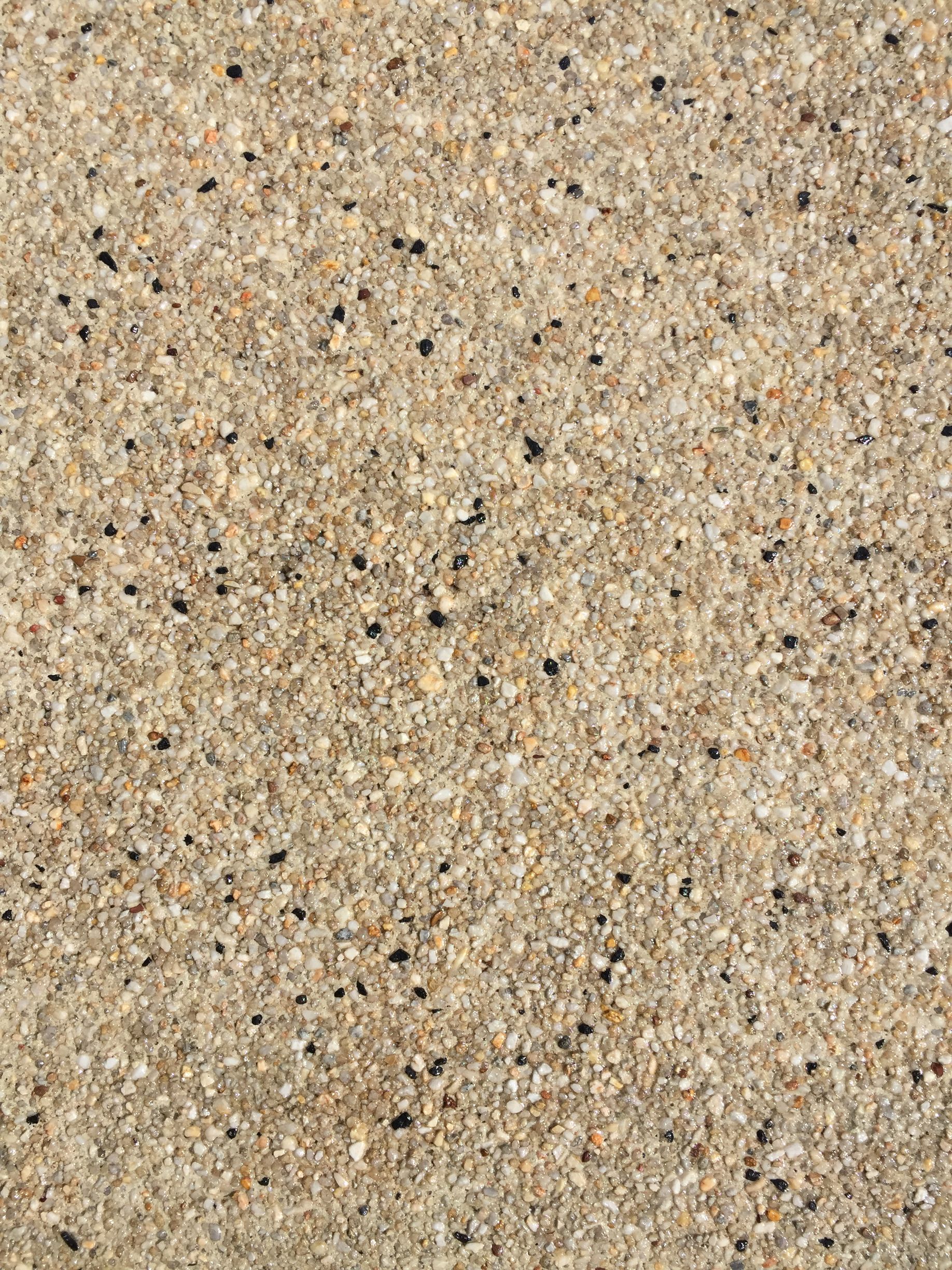 Exposed aggregate sealing in Berwick by Melbourne Concrete Sealing and Resurfacing- Premium high-gloss finish.