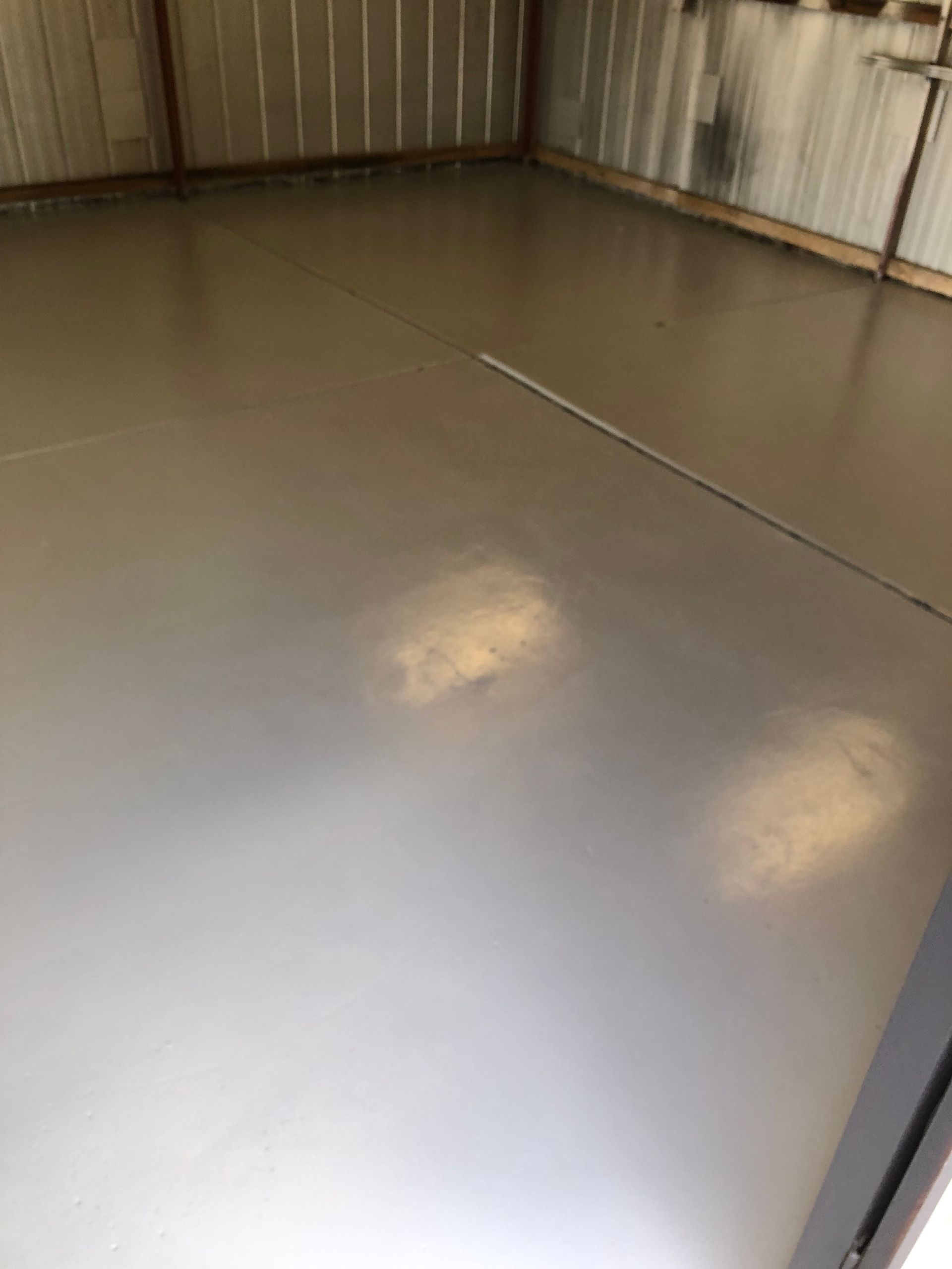 Hand-rolled Prime Exposure water-based garage floor sealing in Keilor Downs by Melbourne Concrete Sealing.