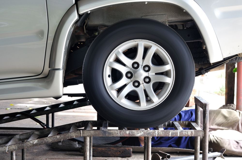 Car Lifted on A Vehicle Hoist — Ballina Tyrepro in Byron Bay, NSW