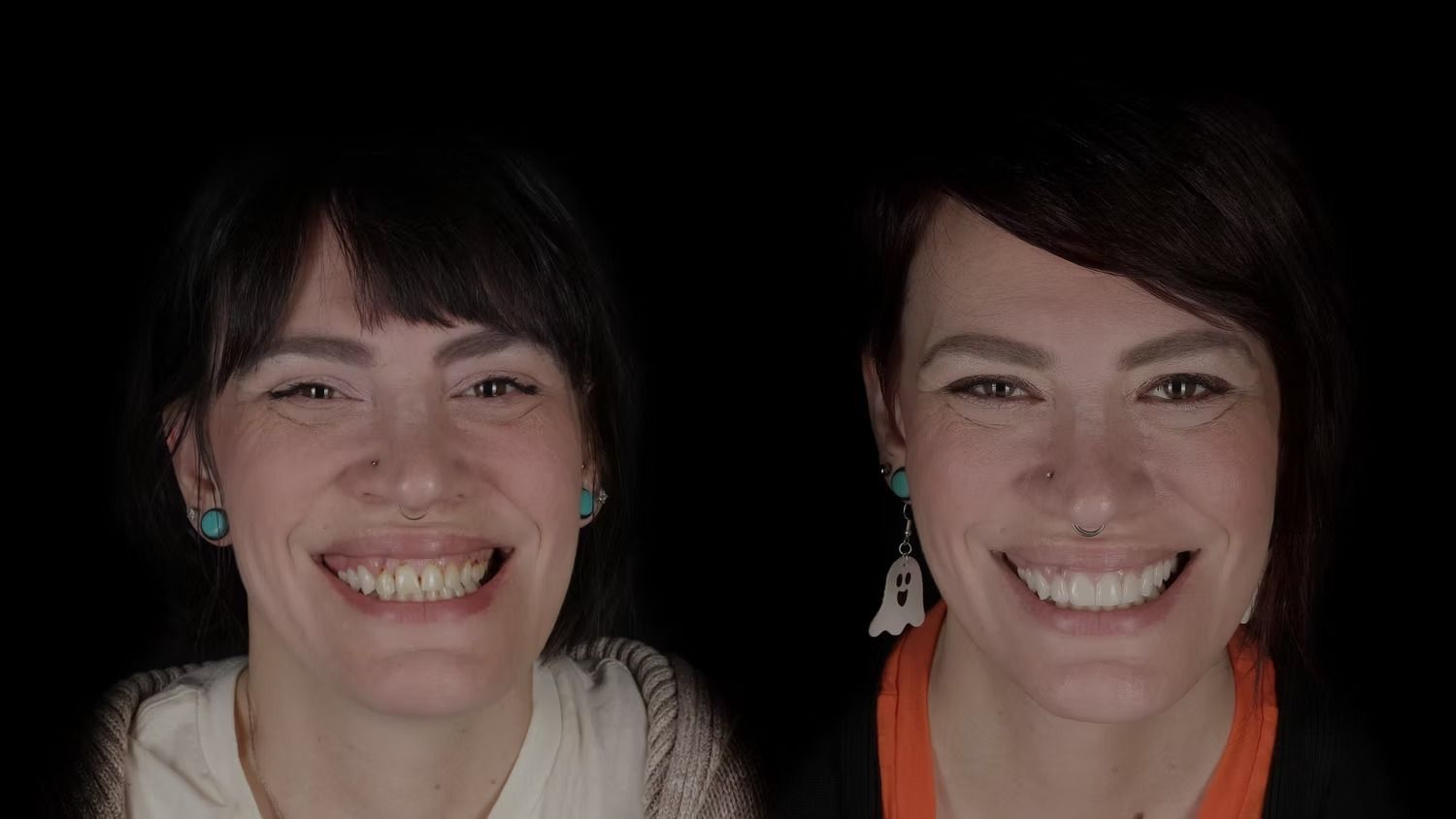 Two women smiling broadly against a black background. One wears a white top, the other an orange top.