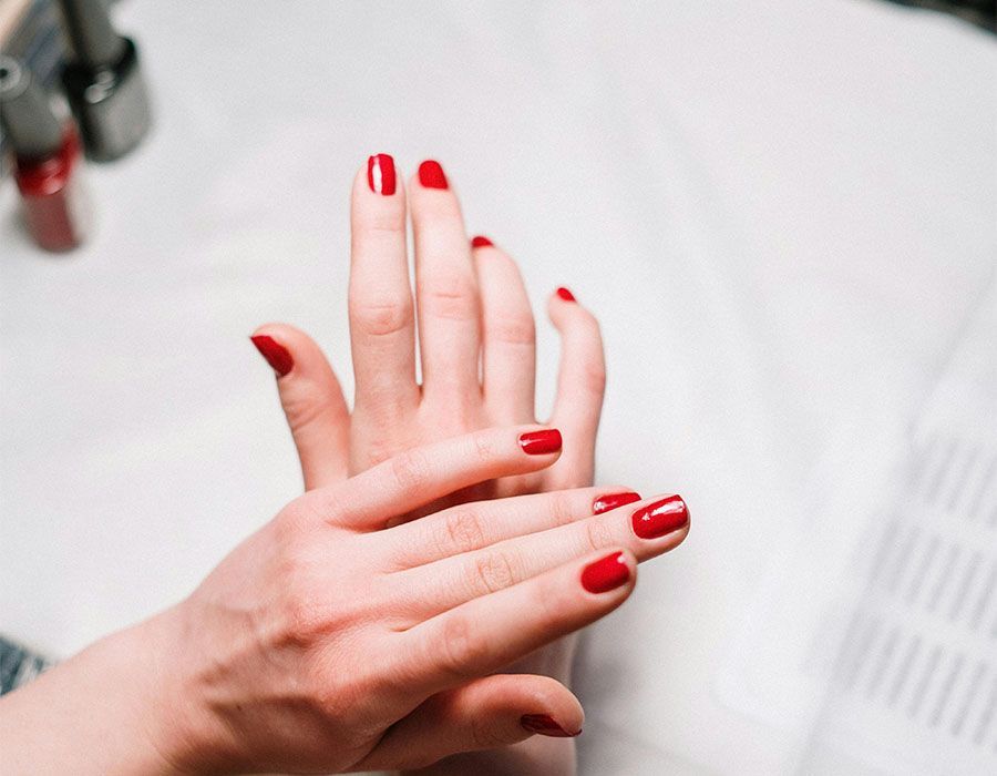 Hands giving a back massage on a person lying face down