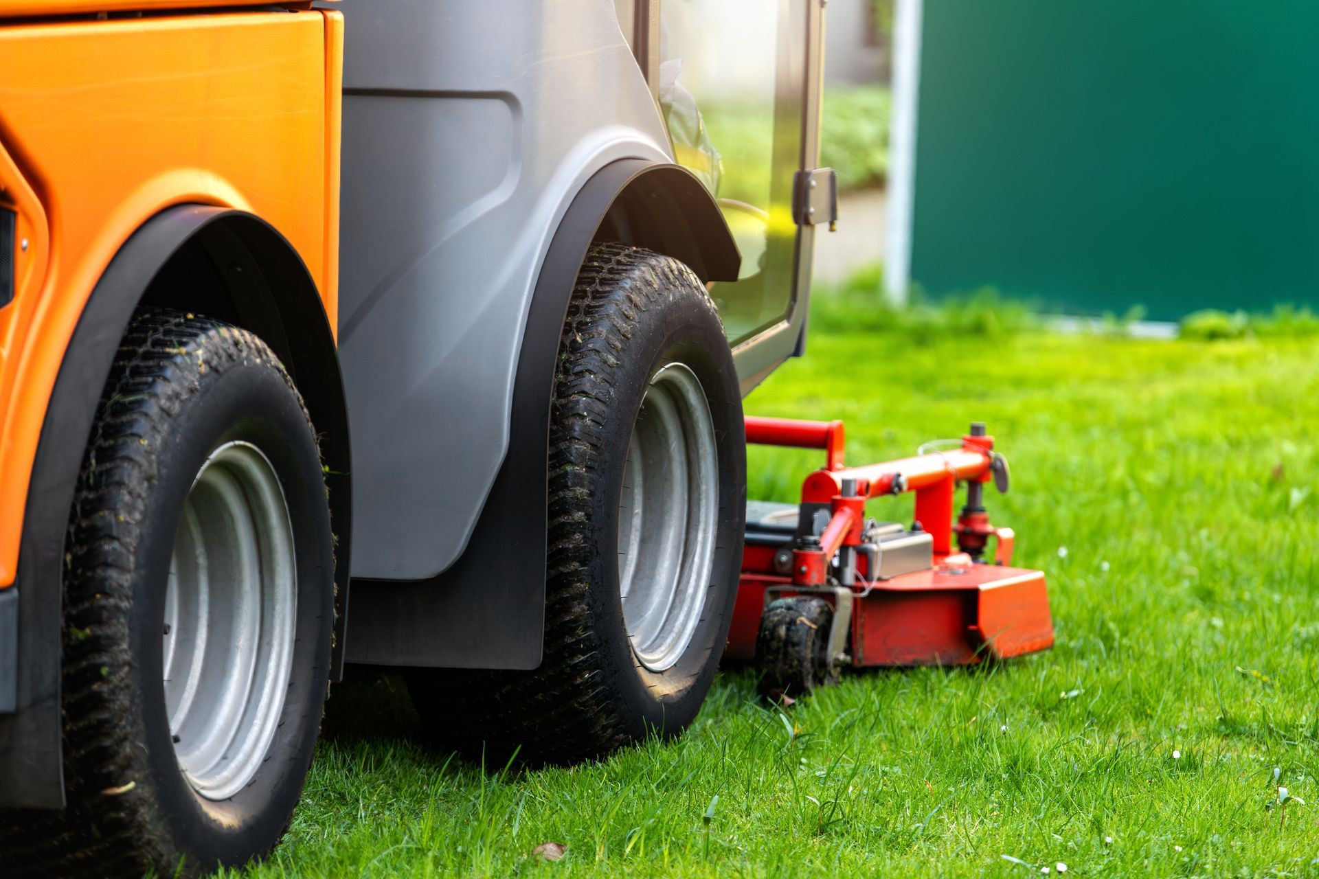 Lawn tractor dealer showroom with riding mowers lined up for comparison.